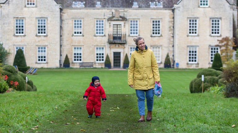 Visitors and the south front of the house at Nunnington Hall, North Yorkshire